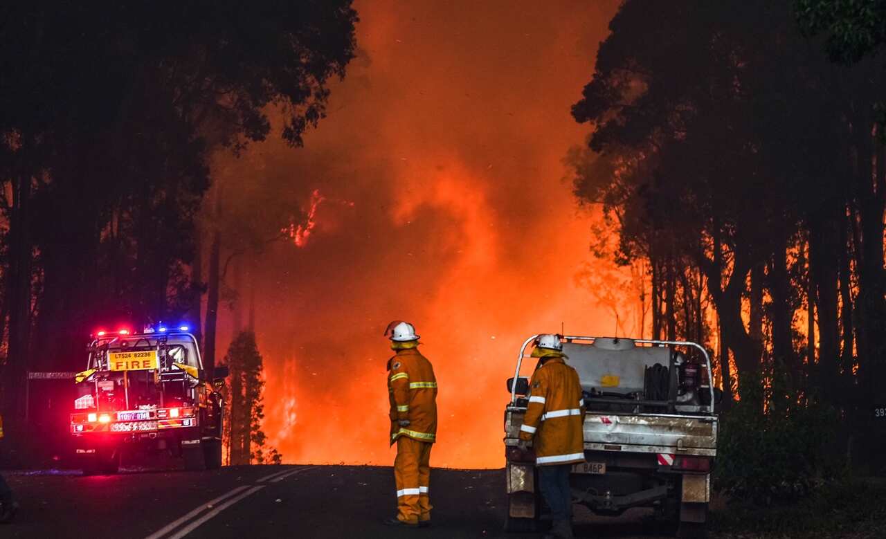A supplied image obtained on Sunday, February 6, 2022, of Fire fighters in Western Australia battling a blaze at Bridgetown, WA. 