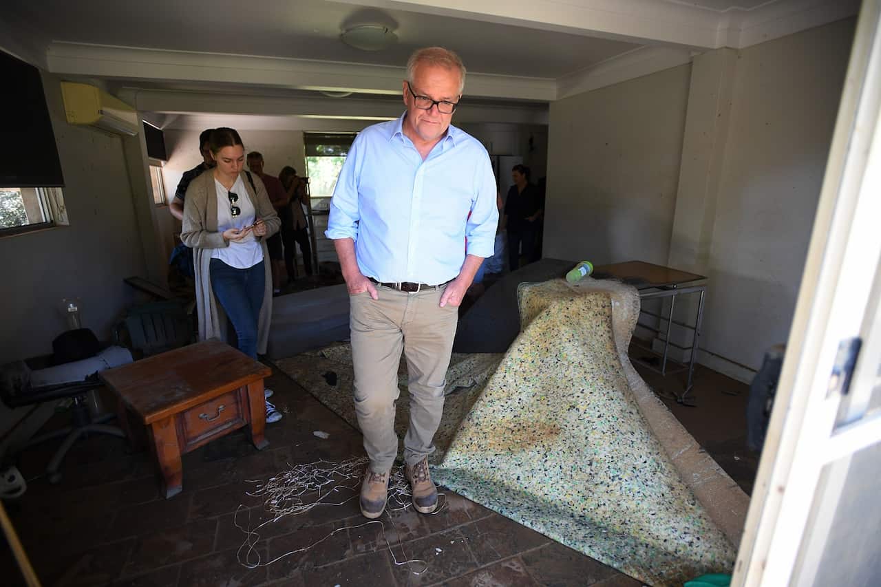 Scott Morrison and his wife Jenny visit the flood affected property of Darren Vaughan and Chloe Konispoliatis