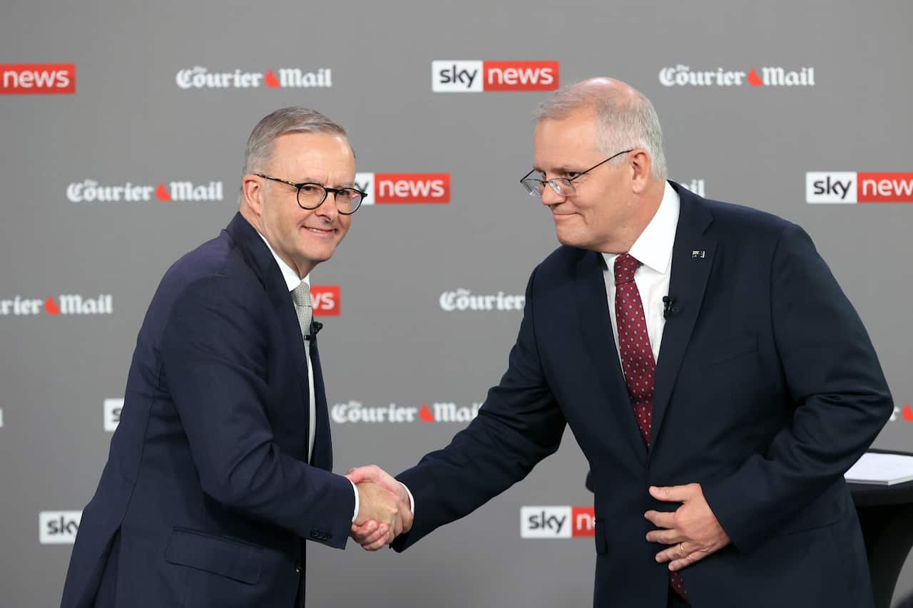 Australian Opposition Leader Anthony Albanese (left) shakes hands with Australian Prime Minister Scott Morrison during the first leaders' debate of the 2022 federal election hosted by Sky News at the Gabba in Brisbane