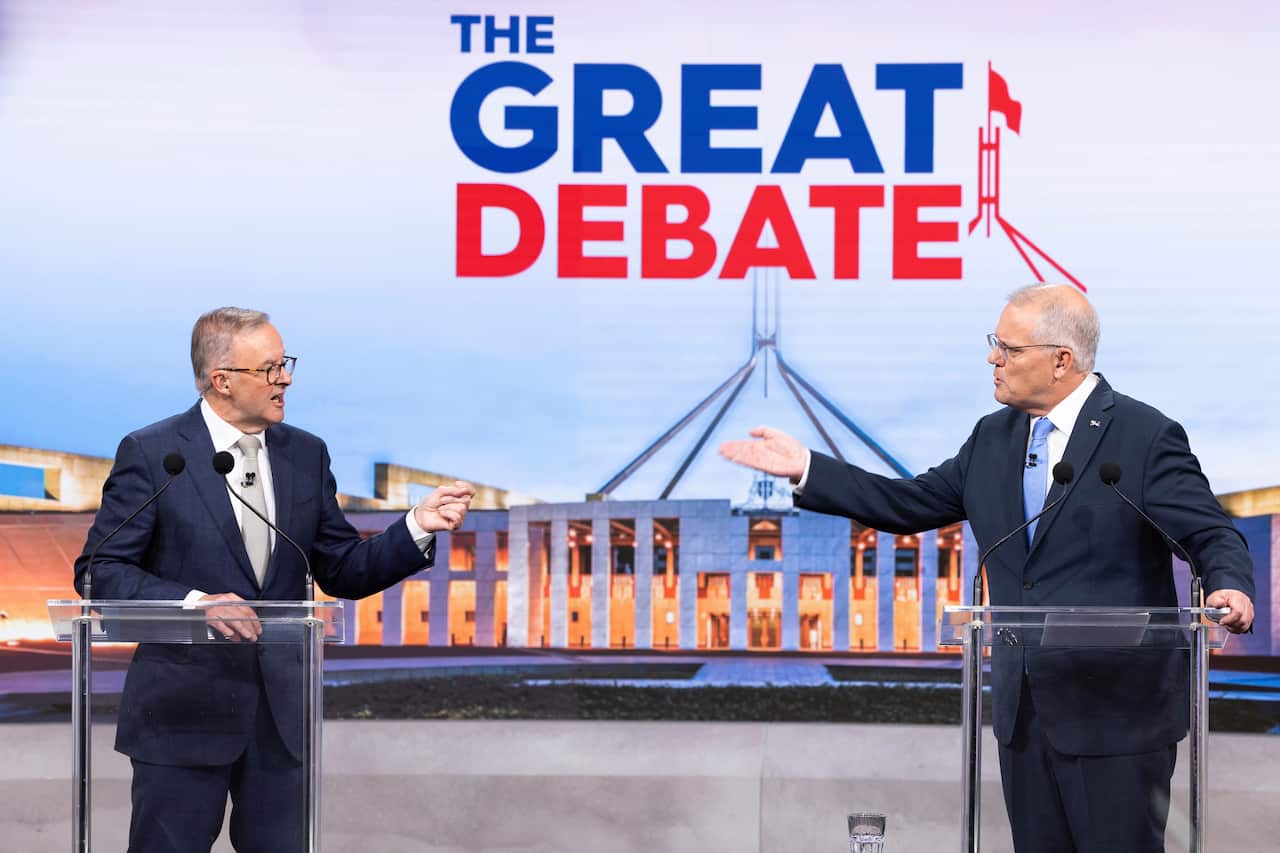 Australian Prime Minister Scott Morrison (right) and Opposition Leader Anthony Albanese during the second leaders' debate ahead of the federal election at Nine Studios in Sydney, Sunday, May 8, 2022. (AAP Image/Pool, Alex Ellinghausen) NO ARCHIVING