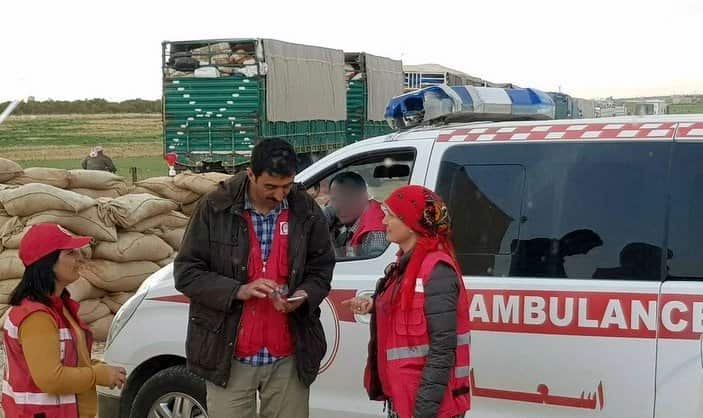Dr Nemam Ghafouri (right) with aid workers