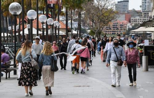 People wear face masks in Circular Quay in Sydney, Australia. 