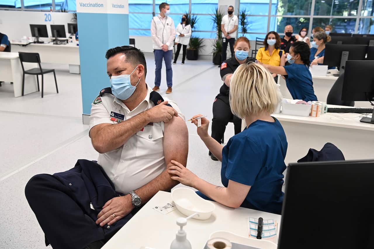 A Pfizer vaccine is administered at the COVID-19 Vaccination Centre in Sydney 