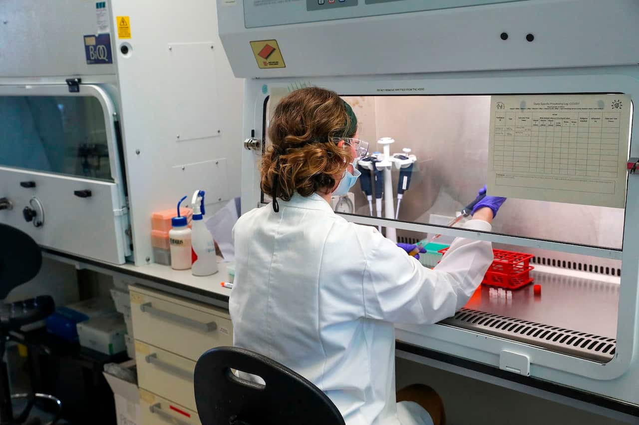 A scientist working at Oxford Vaccine Group's laboratory 