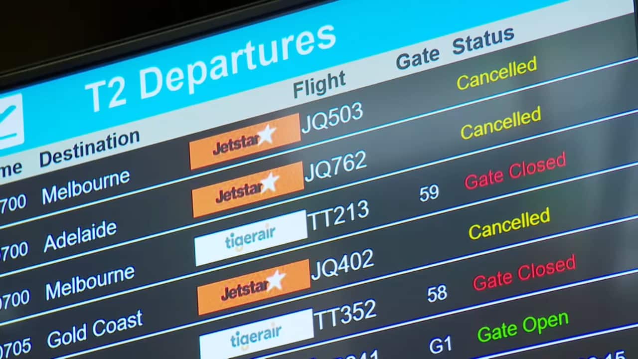 Screen at Sydney airport showing cancelled flights