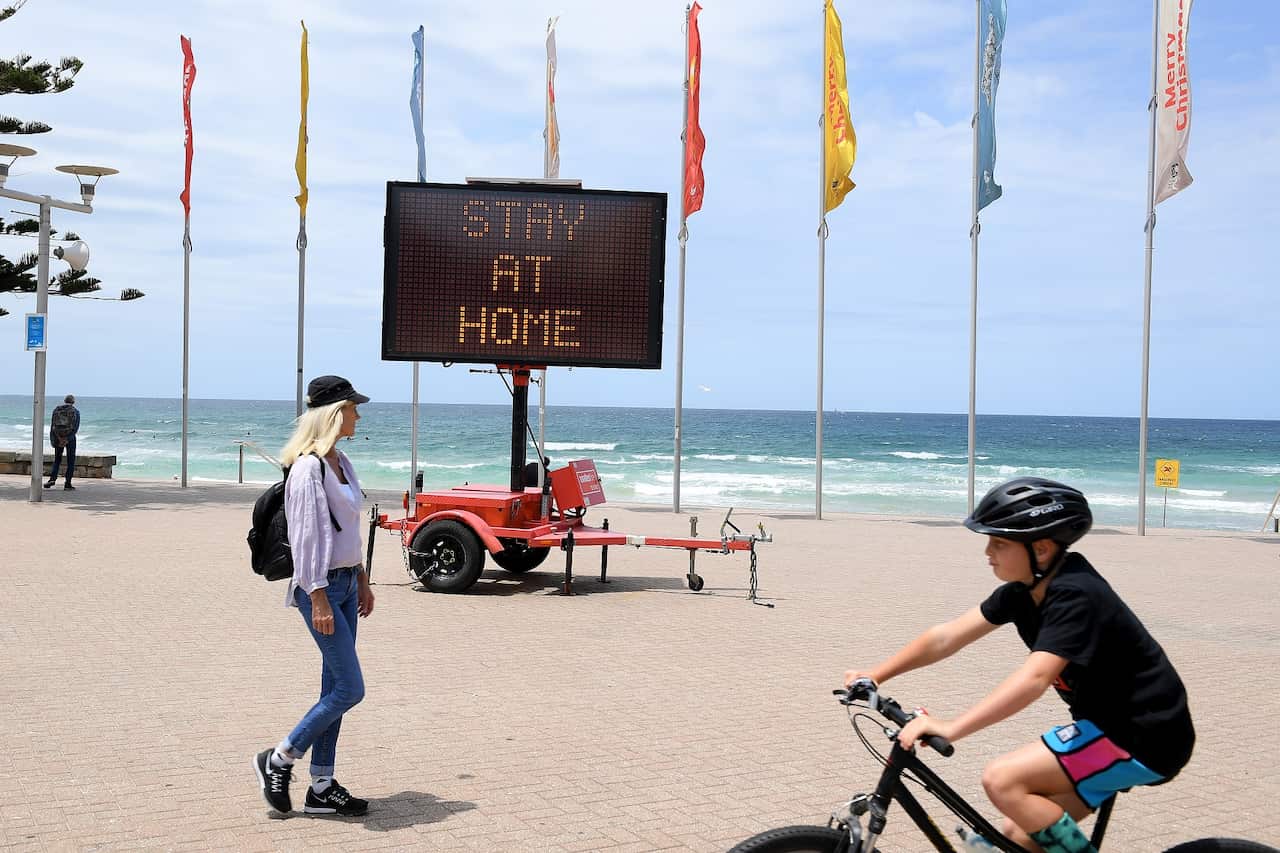 A 'Stay at Home' sign on Manly beach, in Sydney 