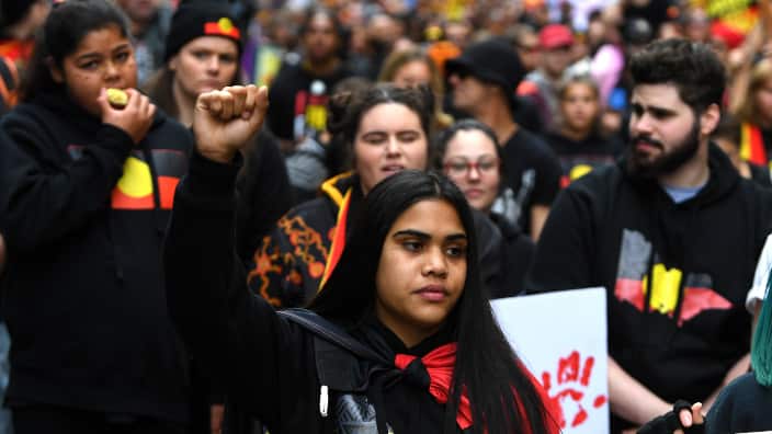 People participate in a NAIDOC (National Aboriginal and Islanders Day Observance Committee) Week march in Melbourne