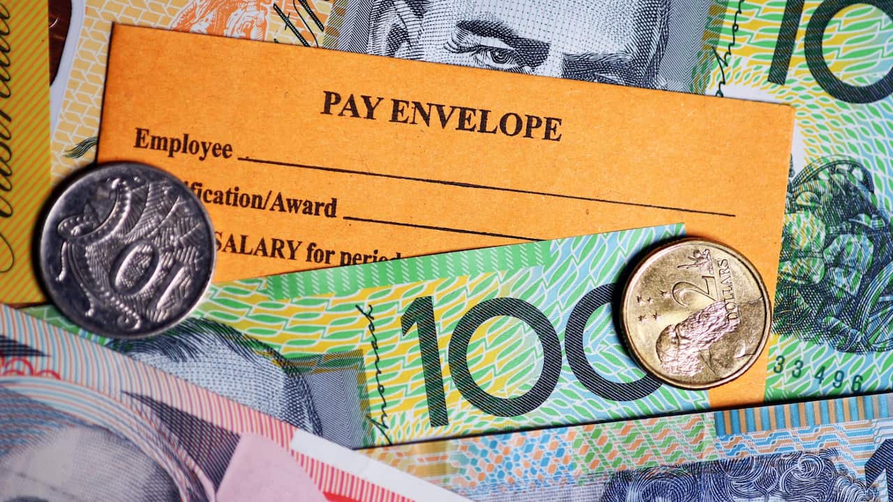 A stock photograph of Australian currency and a wages envelope