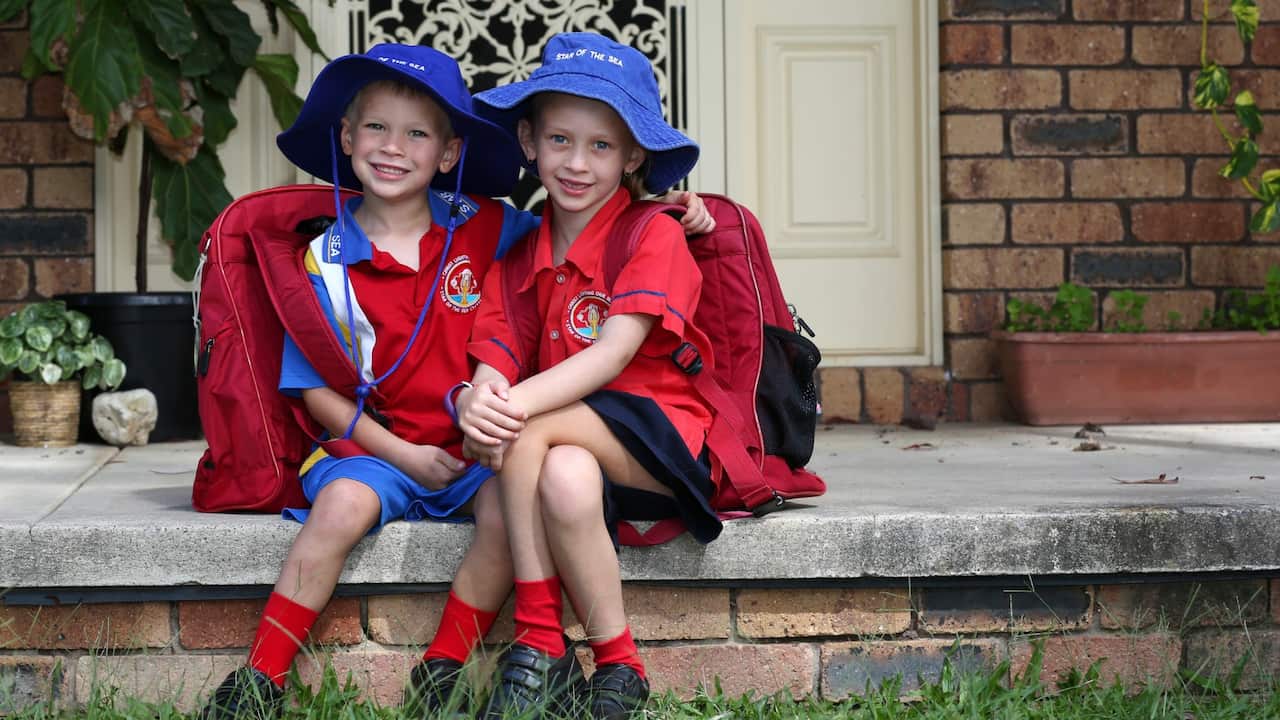 Brisbane kids outside home in school uniforms 