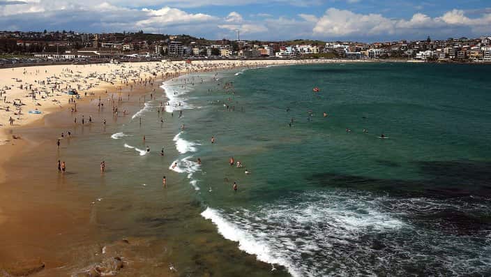 Beachgoers gather at Bondi Beach, Sydney, Saturday, January 13, 2018. (AAP Image/Jeremy Ng) NO ARCHIVING