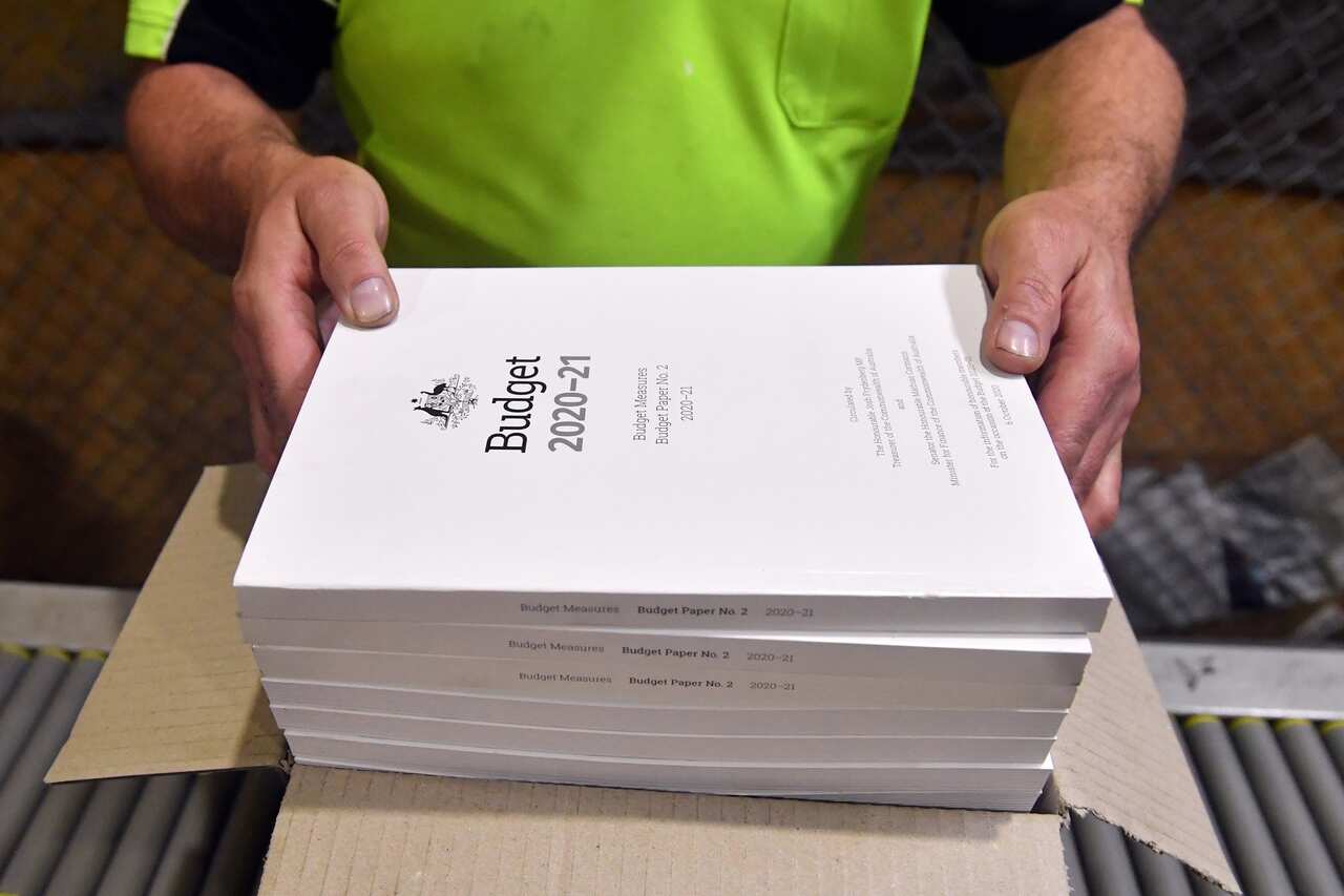 The 2020-2021 Budget Papers are seen at a printing facility prior to being delivered to Parliament House in Canberra, Sunday, October 4, 2020. (AAP Image/Mick Tsikas) NO ARCHIVING