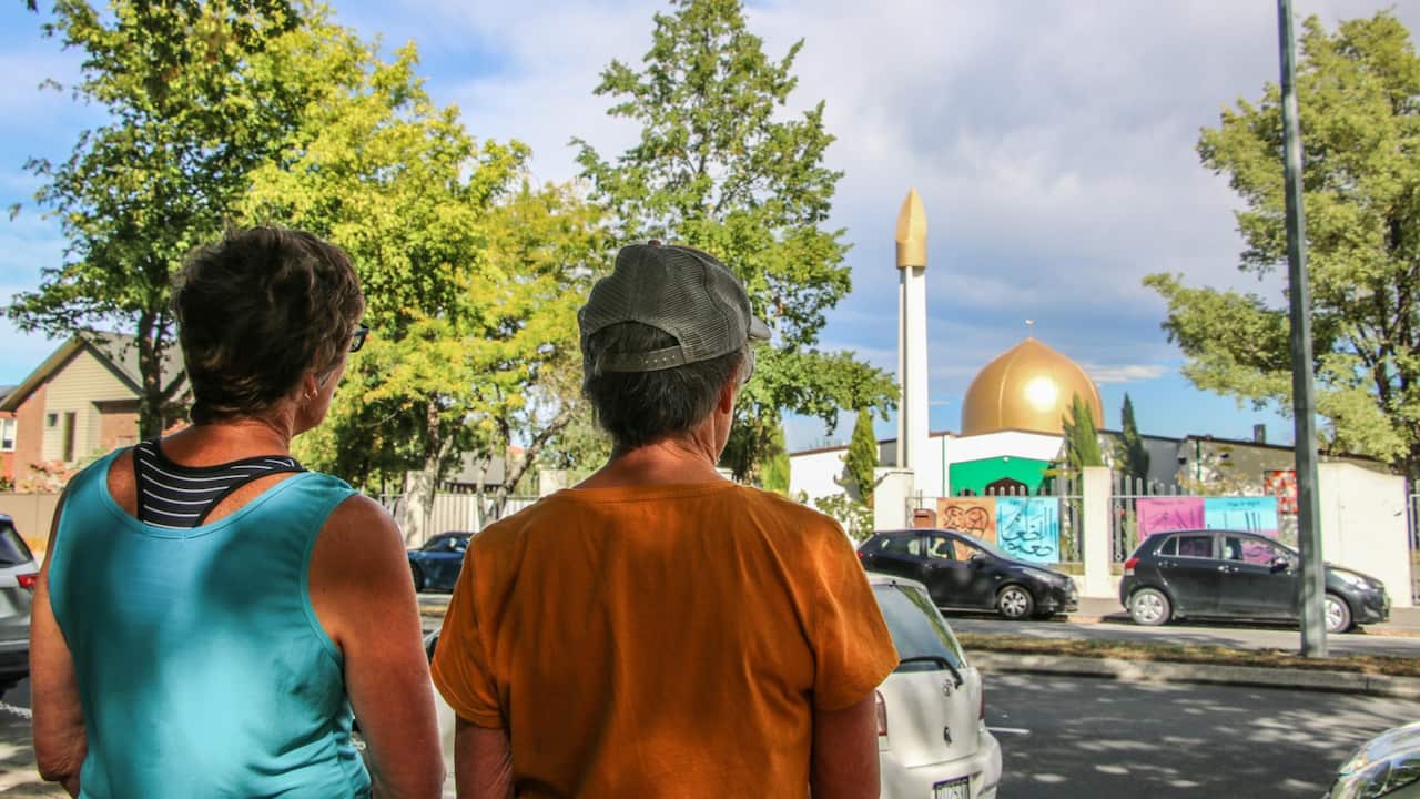Two tourists of Christchurch stand opposite the Al Noor Mosque, they said they were shocked to hear someone had mad terror threats to be carried out there.