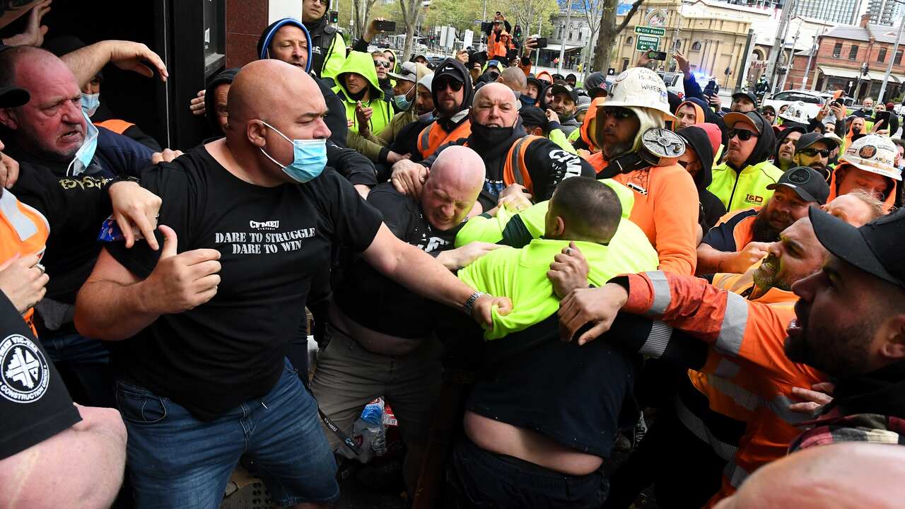 Construction workers clash with unionists at a protest at Construction, Forestry, Maritime, Mining and Energy Union (CFMEU) headquarters in Melbourne. 