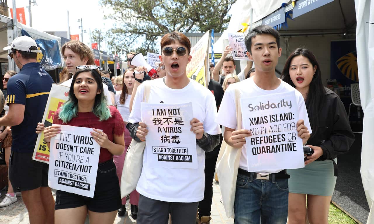 People rally in Sydney on 19 February over the Australian government’s coronavirus strategy and against the travel ban on Chinese visitors.