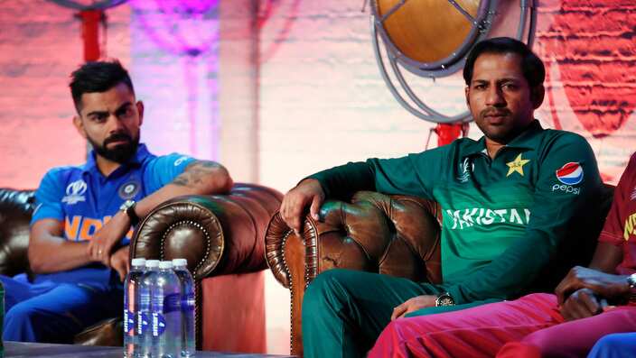 Pakistan's Sarfaraz Ahmed, right and India's Virat Kohli are seated during the Captain's Press Conference, in London, Thursday, May 23, 2019. The Cricket World Cup starts on Thursday May 30. (Andrew Boyers/Pool Photo via AP)