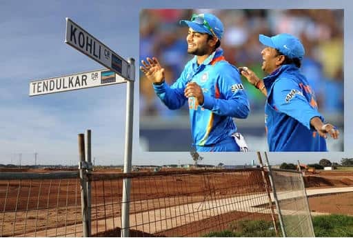 Virat Kohli is congratulated by teammate Sachin Tendulkar