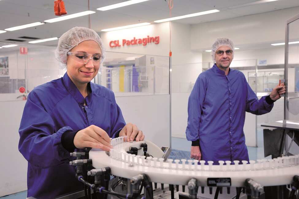 Production Supervisor Eva Dimovski and Operator Rodney Gear processing CSLs seasonal influenza vaccine in CSL Limited's Parkville packaging facility in Melbourne.
