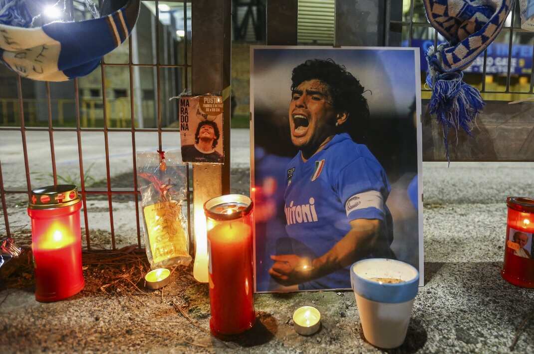 Outside the San Paolo stadium in Naples, people gather to pay homage to the Diego Armando Maradona.