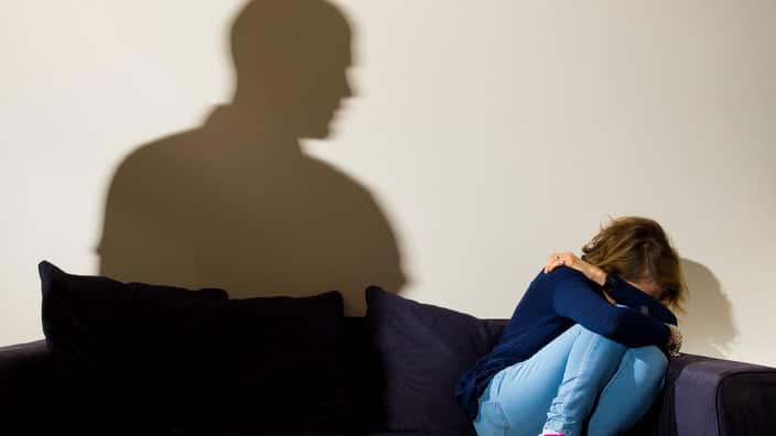 PICTURE POSED BY MODEL A shadow of a man with a clenched fist as a woman cowers in the corner.. Picture date: Monday March 9, 2015. Photo credit should read: Dominic Lipinski/PA Wire