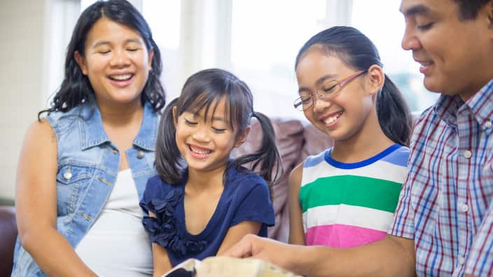 Young family spending time with devotionals