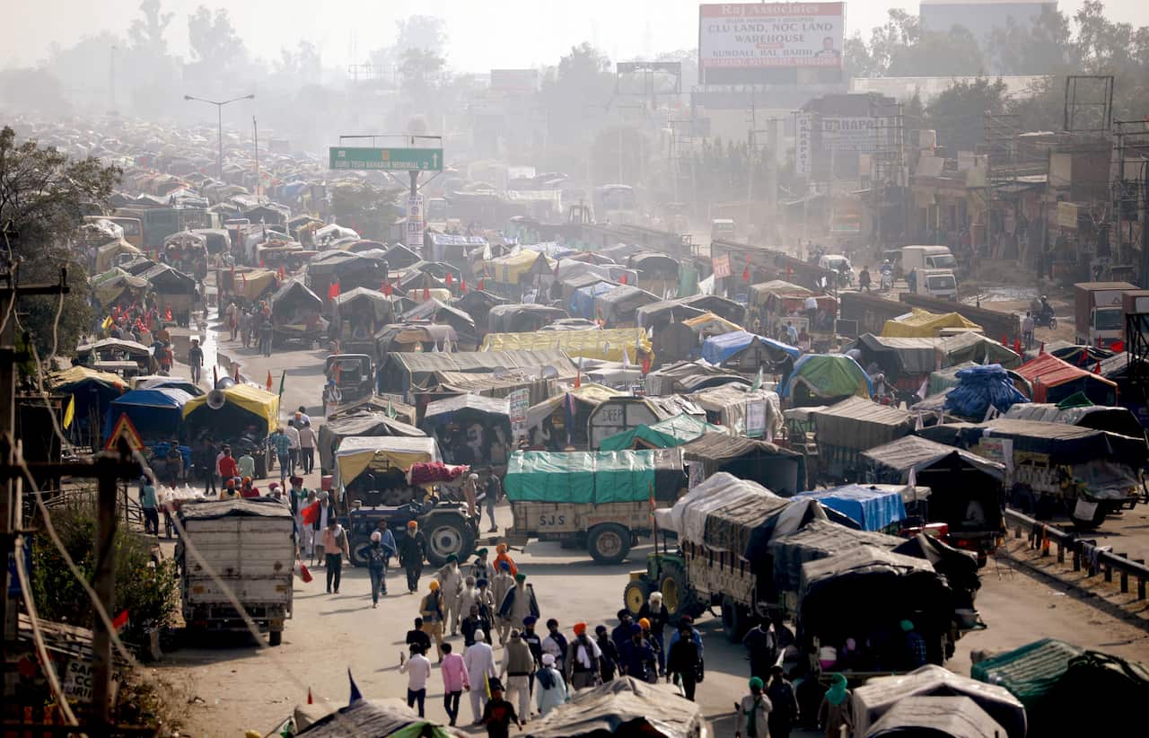 Farmer's trucks and tractors are lined up blocking the way during a protest against the farm laws