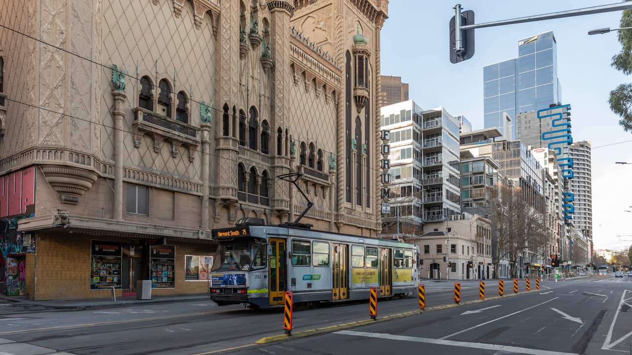 A lone tram on an empty Flinders Street is seen during lockdown in Melbourne, Australia, Wednesday, Aug. 5, 2020. 