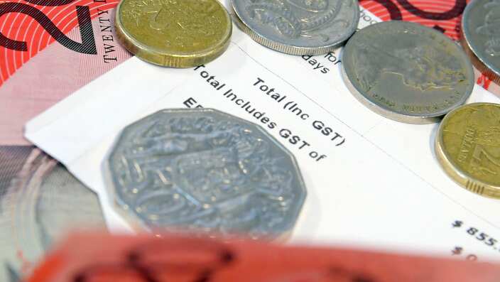 A receipt showing General Sales Tax (GST) is shown alongside Australian notes and coins in Sydney, Wednesday, July 4, 2018. (AAP Image/Sam Mooy) NO ARCHIVING