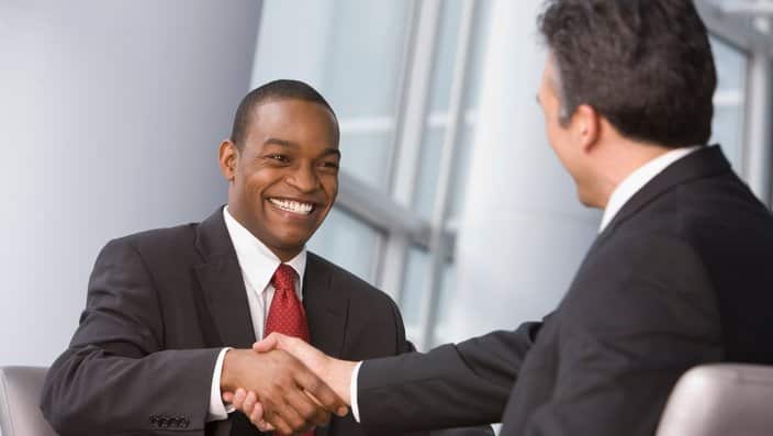  Shaking hands at a job interview