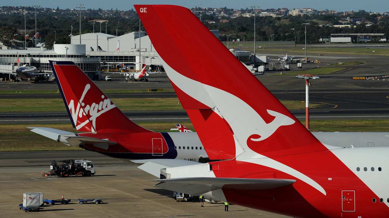 A Qantas (R) and a Virgin (L) plane sit