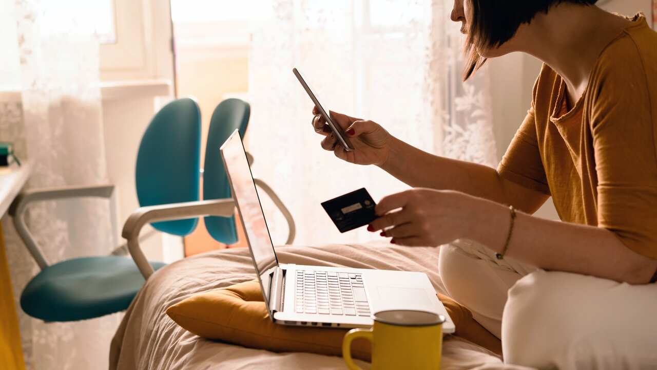 Woman with a laptop shopping online 