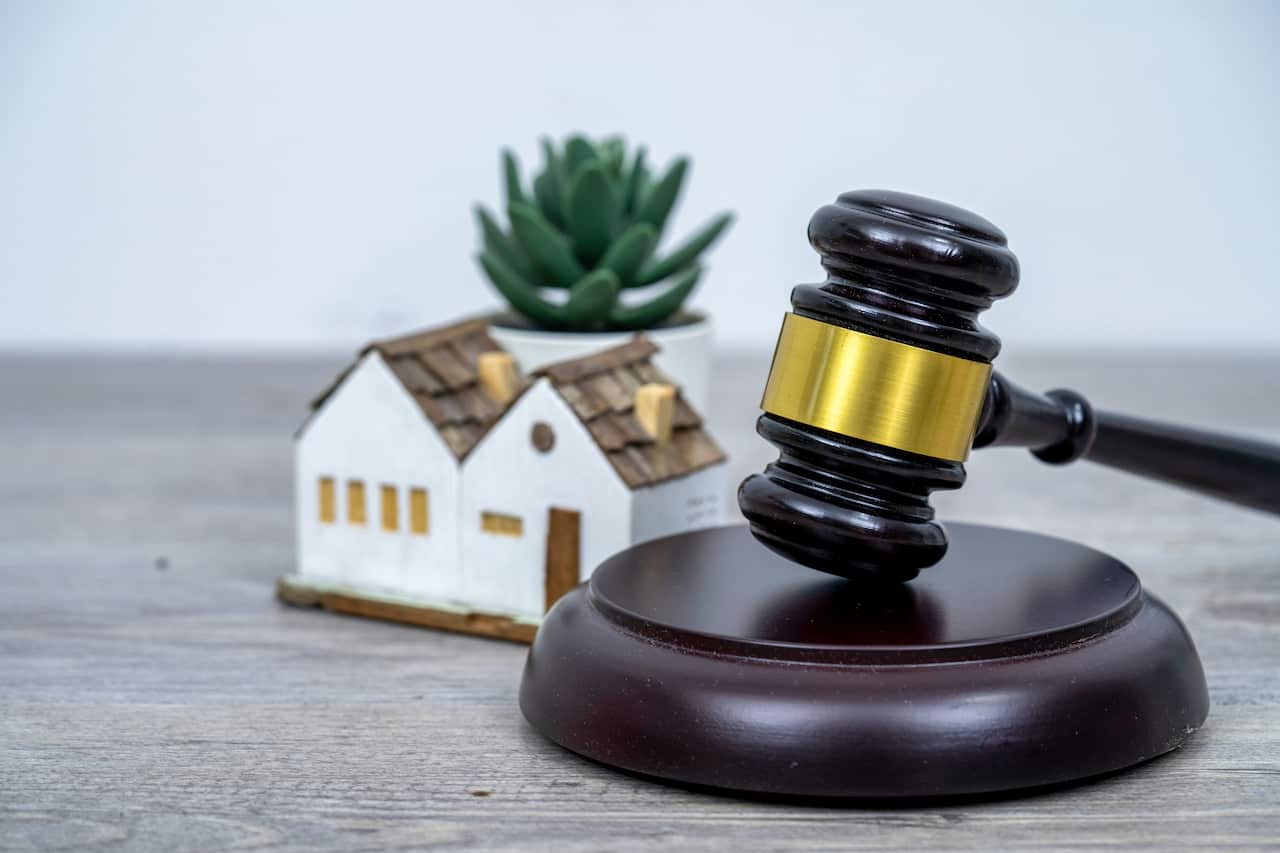 House with gavel. Real estate law and house auction concept.
