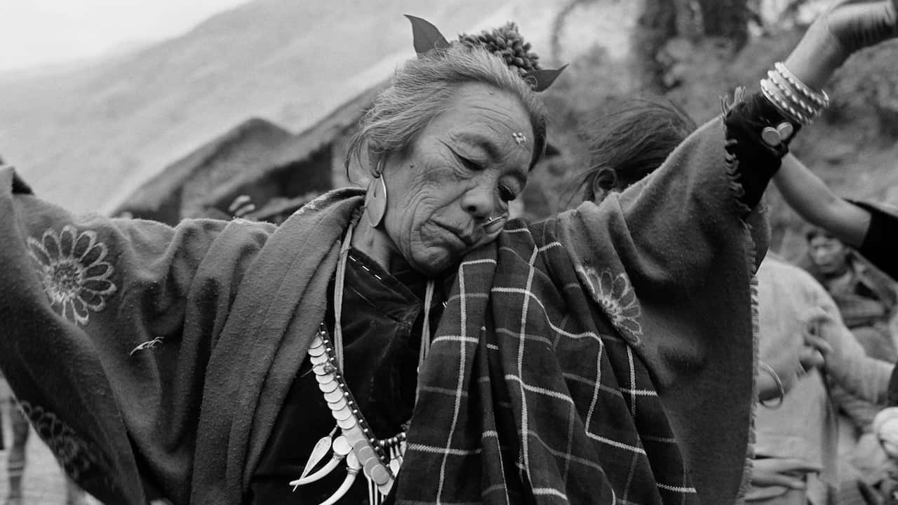 A senior Nepali women dancing at a wedding in Rukum in western Nepal.