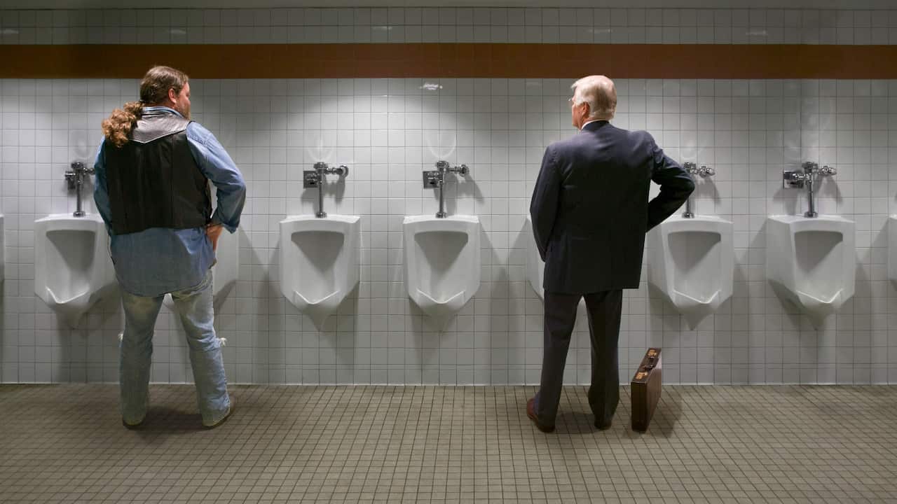 Two men at urinals