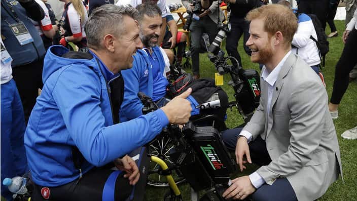 Britain's Prince Harry meets Italian competitors as he attends the Invictus Games cycling competition