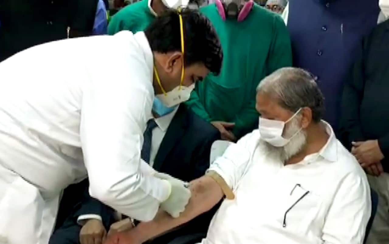 Haryana Health Minister Anil Vij being administered a trial dose of Covaxin