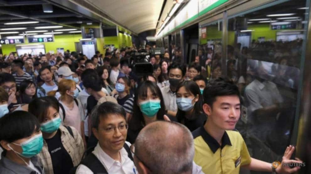 Anti-extradition bill demonstrators block an MTR train in Hong Kong.