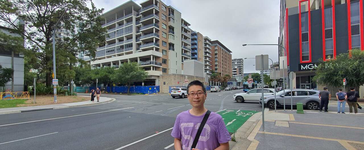 Alex Chan in front of the Mascot Towers building.