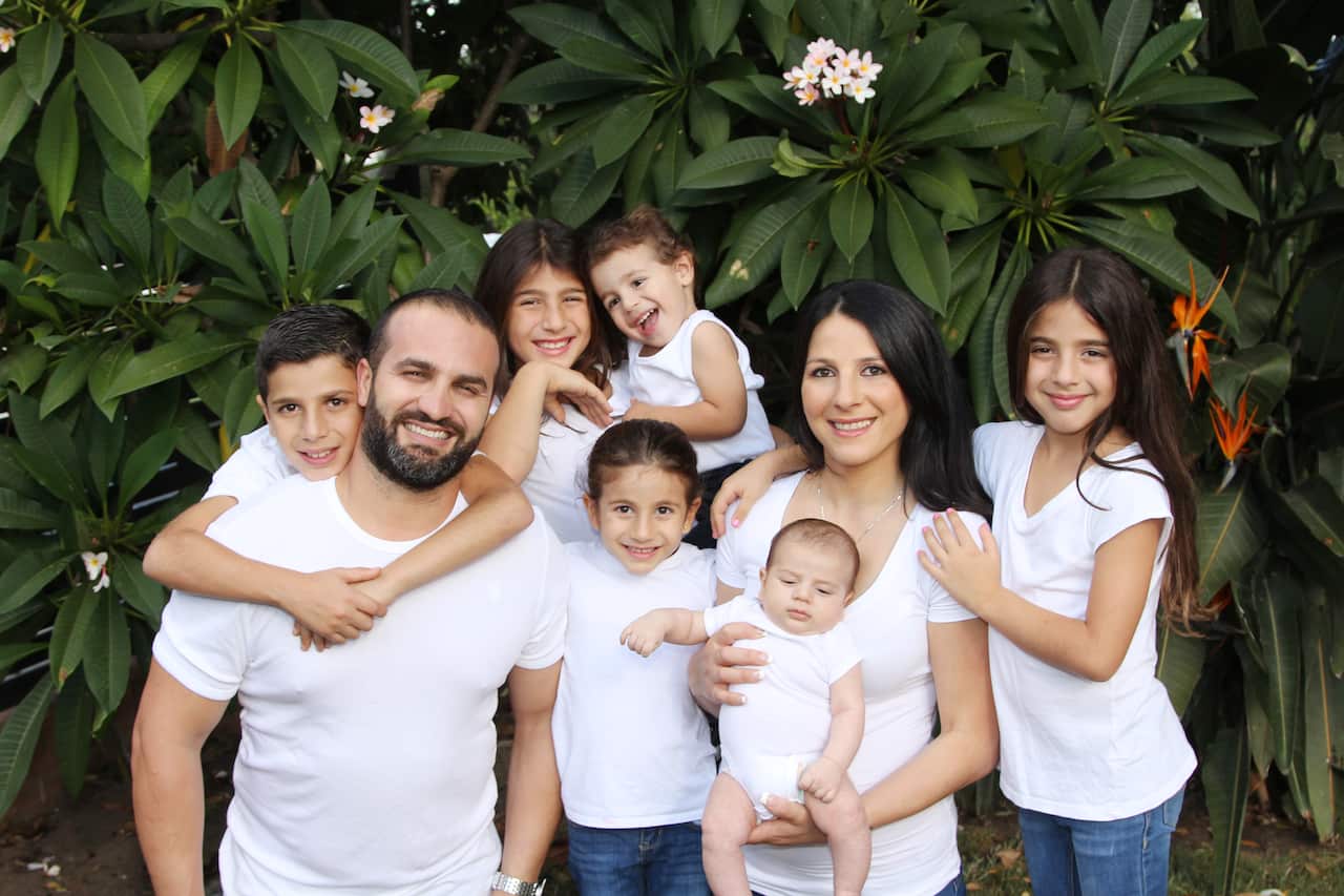 A family photo of the Abdallah family.