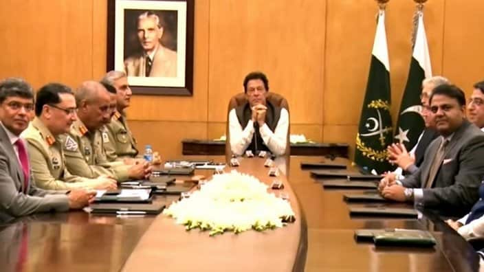 File photo of Pakistan PM Imran Khan holding a meeting of military and other officials