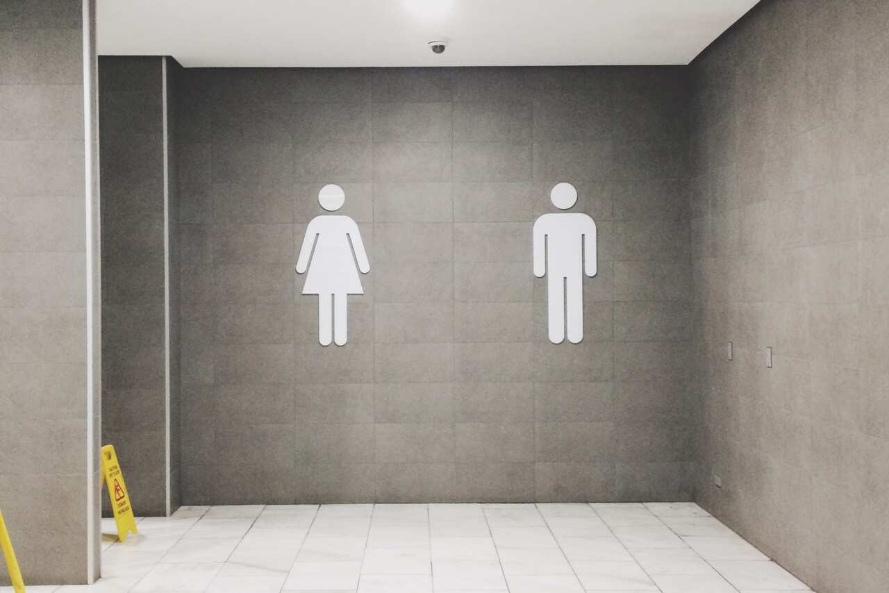 male and woman bathroom sign 
