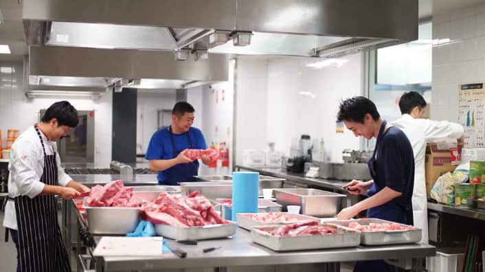 Food preparation at William Angliss Institute. Masahiko (centre) and Kentaro Chen (left)