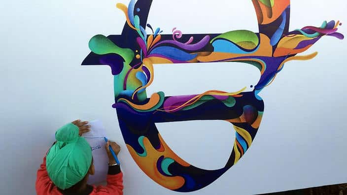 A child learning the Punjabi alphabet