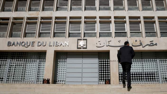 a man heads to the Lebanese central bank, in Beirut, Lebanon.