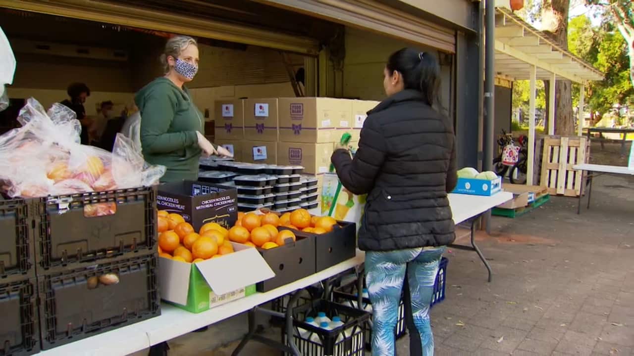 Lining up at a food bank for students (SBS)