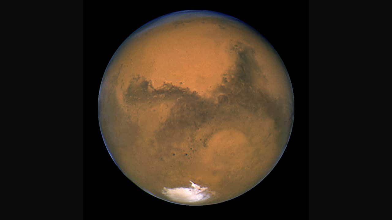 2003 image made available by NASA shows Mars as it lines up with the Sun and the Earth.