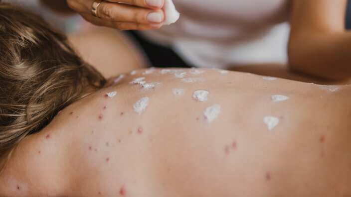 Mother nursing sick child At Home