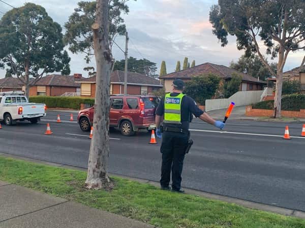 Victoria Police officers begin to enforce the coronavirus lockdowns in more than 30 suburbs.