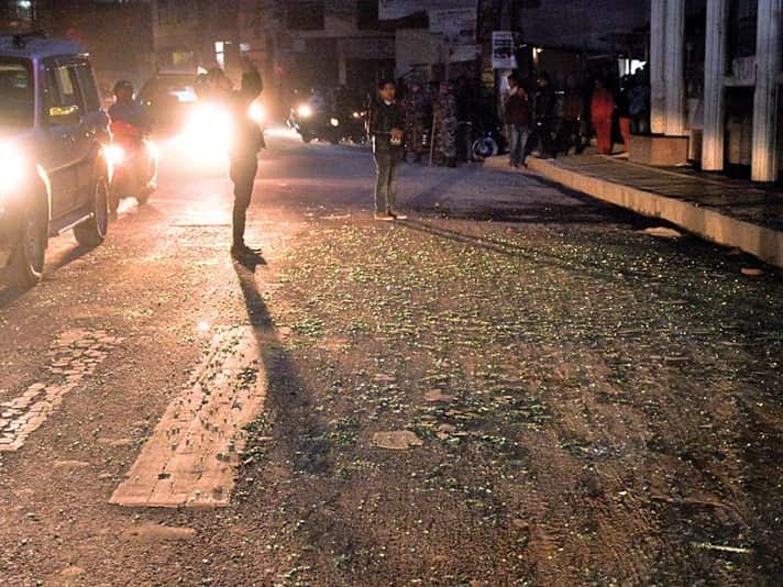 This image shows shards of glass shattered from roadside showrooms littering on street outside Ncell office in Nakkhu, Lalitpur, on Friday, February 22, 2019. The blast outside Ncell office left three people injured. Photo: Naresh Shrestha/THT