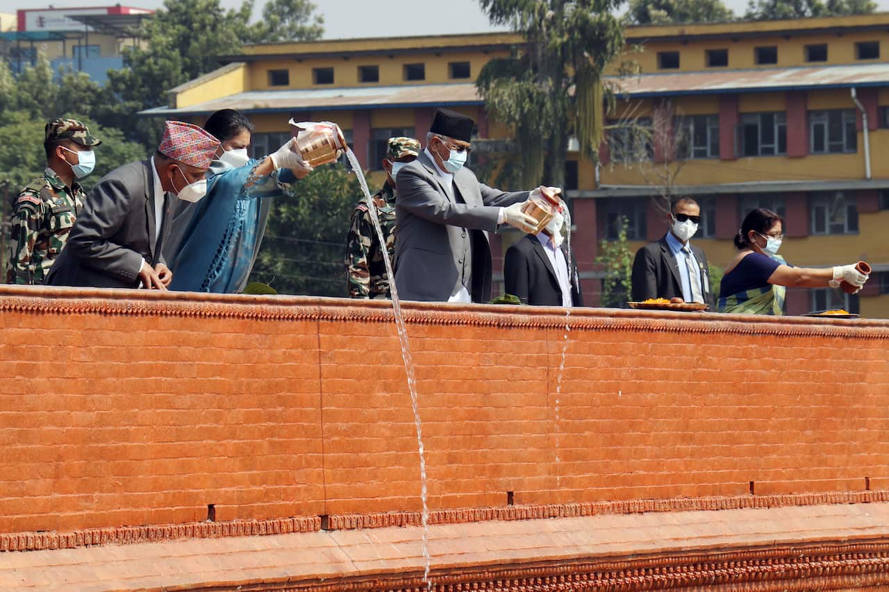 Nepal's President Bidya Bhandari and Prime Minister KP Sharma Oli pouring holy water into the newly renovated Rani Pokhari in Kathmandu.