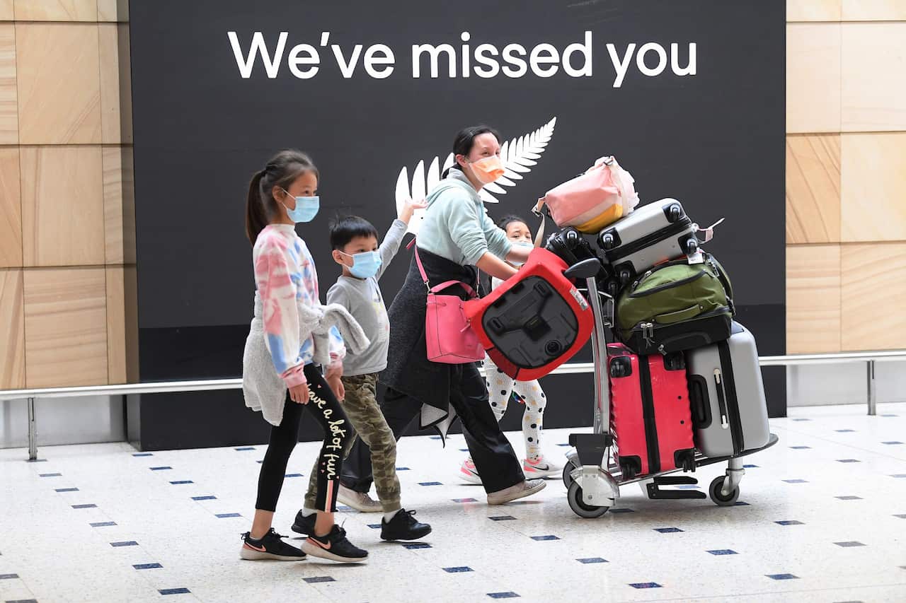 Passengers from New Zealand arrive at Sydney International Airport in Sydney,